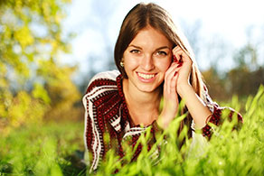A teenage girl smiling