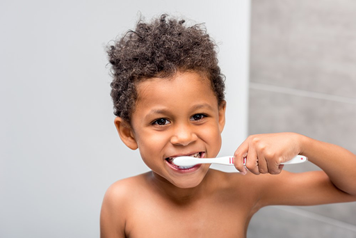 Young boy brushing his teeth.