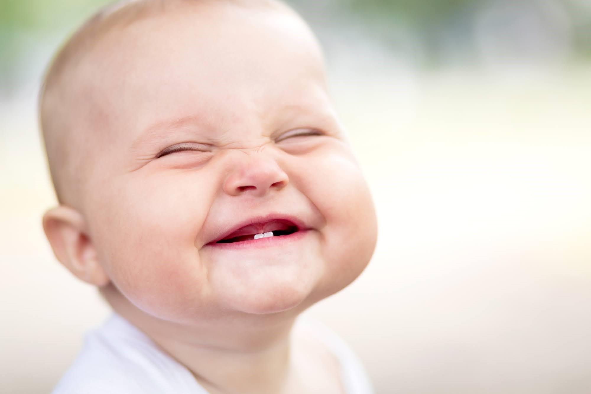 Jan-blog.  Baby smiling with new bottom teeth