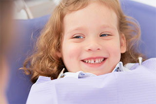 smiling-little-girl-at-dentist